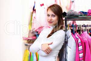 Young woman inside a store buying clothes