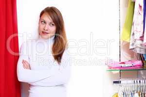 Young woman inside a store buying clothes