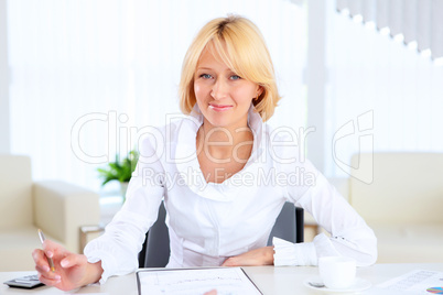 Young beautiful woman in business wear at work Young beautiful woman in business wear at work