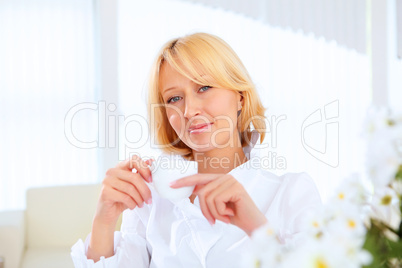 Young beautiful woman in business wear at work