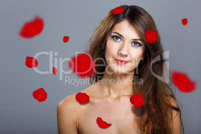 Young woman with flowers on background