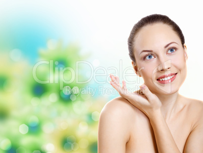 Young woman with flowers on background