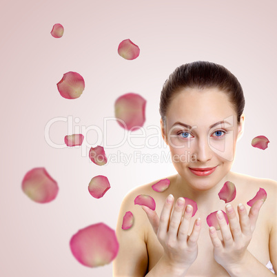 Young woman with flowers on background