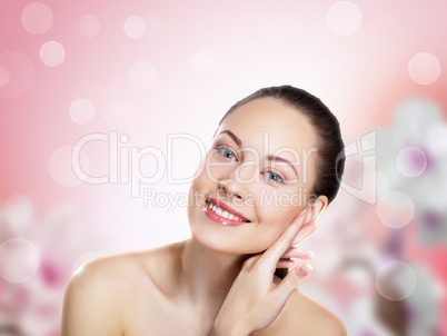 Young woman with flowers on background