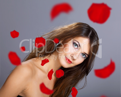 Young woman with flowers on background