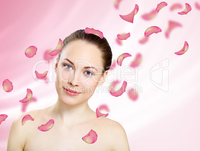 Young woman with flowers on background