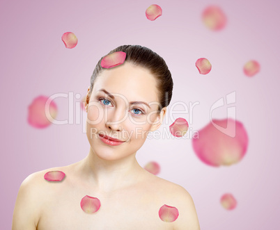 Young woman with flowers on background