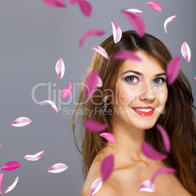 Young woman with flowers on background