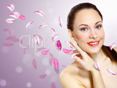 Young woman with flowers on background