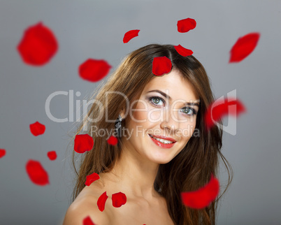 Young woman with flowers on background