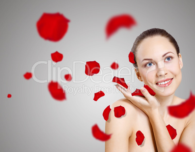 Young woman with flowers on background