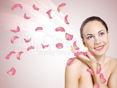 Young woman with flowers on background