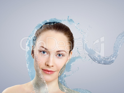 Young woman with water splashes