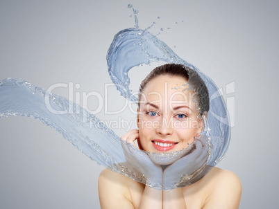 Young woman with water splashes