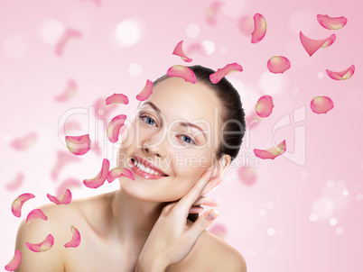 Young woman with flowers on background