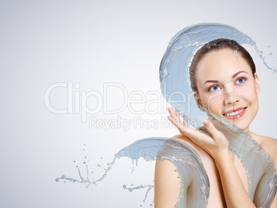 Young woman with water splashes