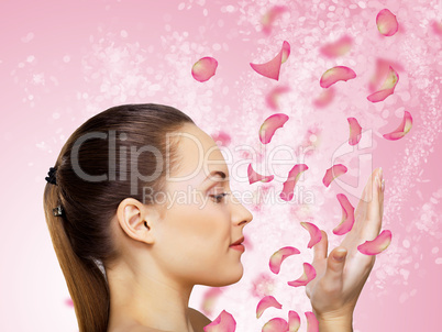 Young woman with flowers on background