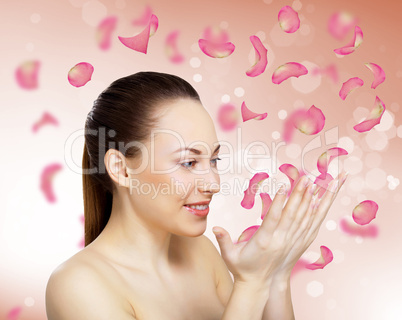 Young woman with flowers on background