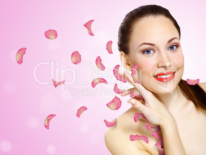 Young woman with flowers on background