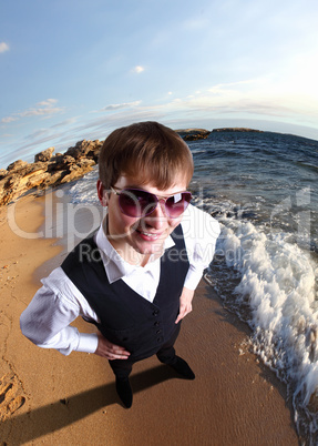 Young businessman against sea background
