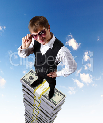 Young businessman with money symbols