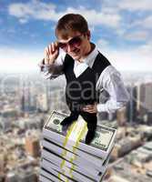 Young businessman with money symbols