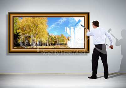 Young businessman and nature background