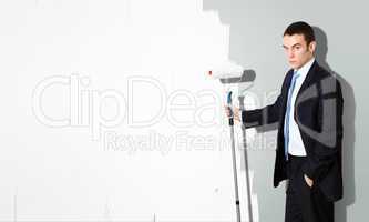 Young businessman with a paint brush