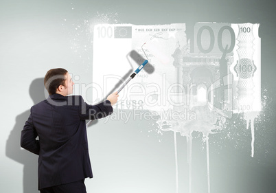 Businessman with a paint brush and banknote