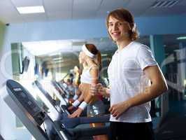 Young man doing sport in gym