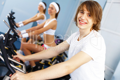 Young man doing sport in gym