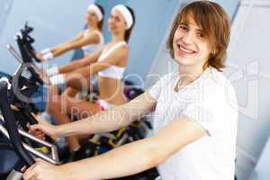 Young man doing sport in gym