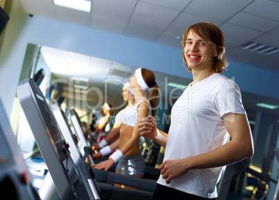 Young man doing sport in gym