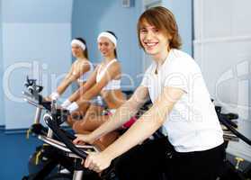 Young man doing sport in gym