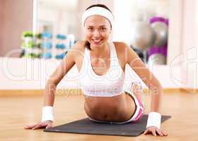 Young woman doing sport in gym