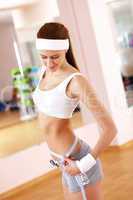 Young woman doing sport in gym