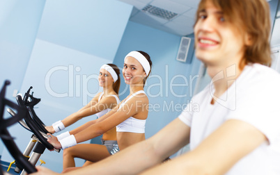 Young man doing sport in gym