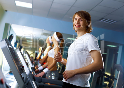 Young man doing sport in gym