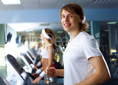 Young man doing sport in gym