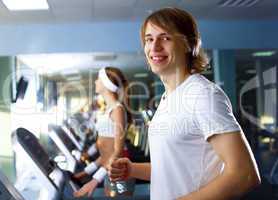 Young man doing sport in gym