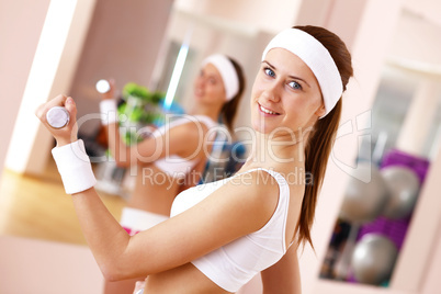 Young woman doing sport in gym