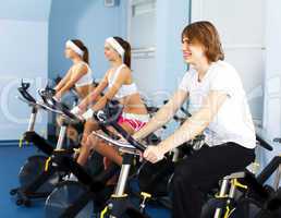 Young man doing sport in gym