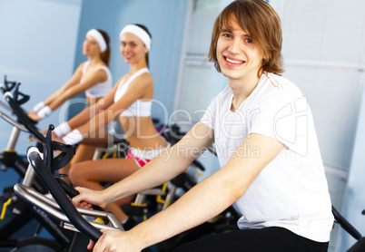 Young man doing sport in gym