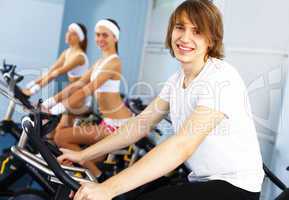 Young man doing sport in gym