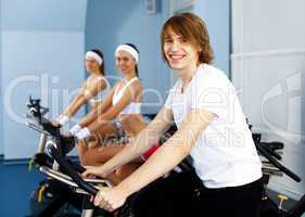 Young man doing sport in gym