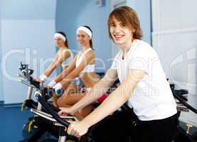 Young man doing sport in gym