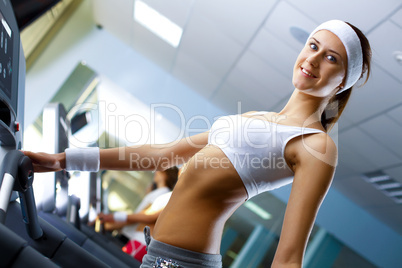 Young woman doing sport in gym