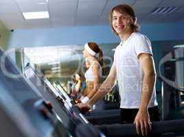 Young man doing sport in gym