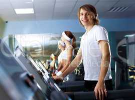 Young man doing sport in gym