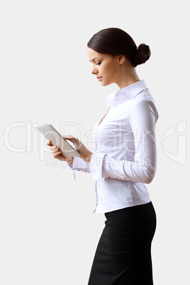 Young beautiful woman in business wear at work